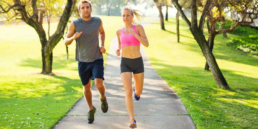 Couple running together in the park