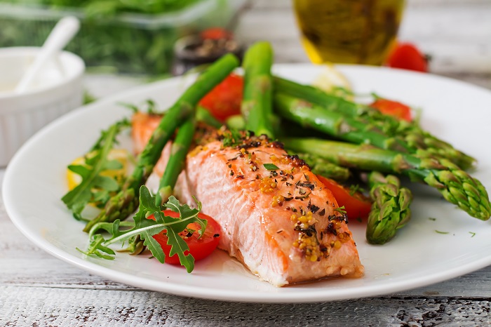 Baked salmon garnished with asparagus